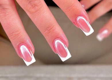 Elegant French manicure at JB Nails - Jordie Barber, Plymouth, England, GB. Perfectly polished tips showcase finesse.