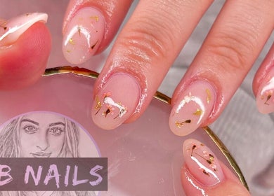 Elegant nail design at JB Nails - Jordie Barber in Plymouth, England, GB, showcasing gold and floral accents.
