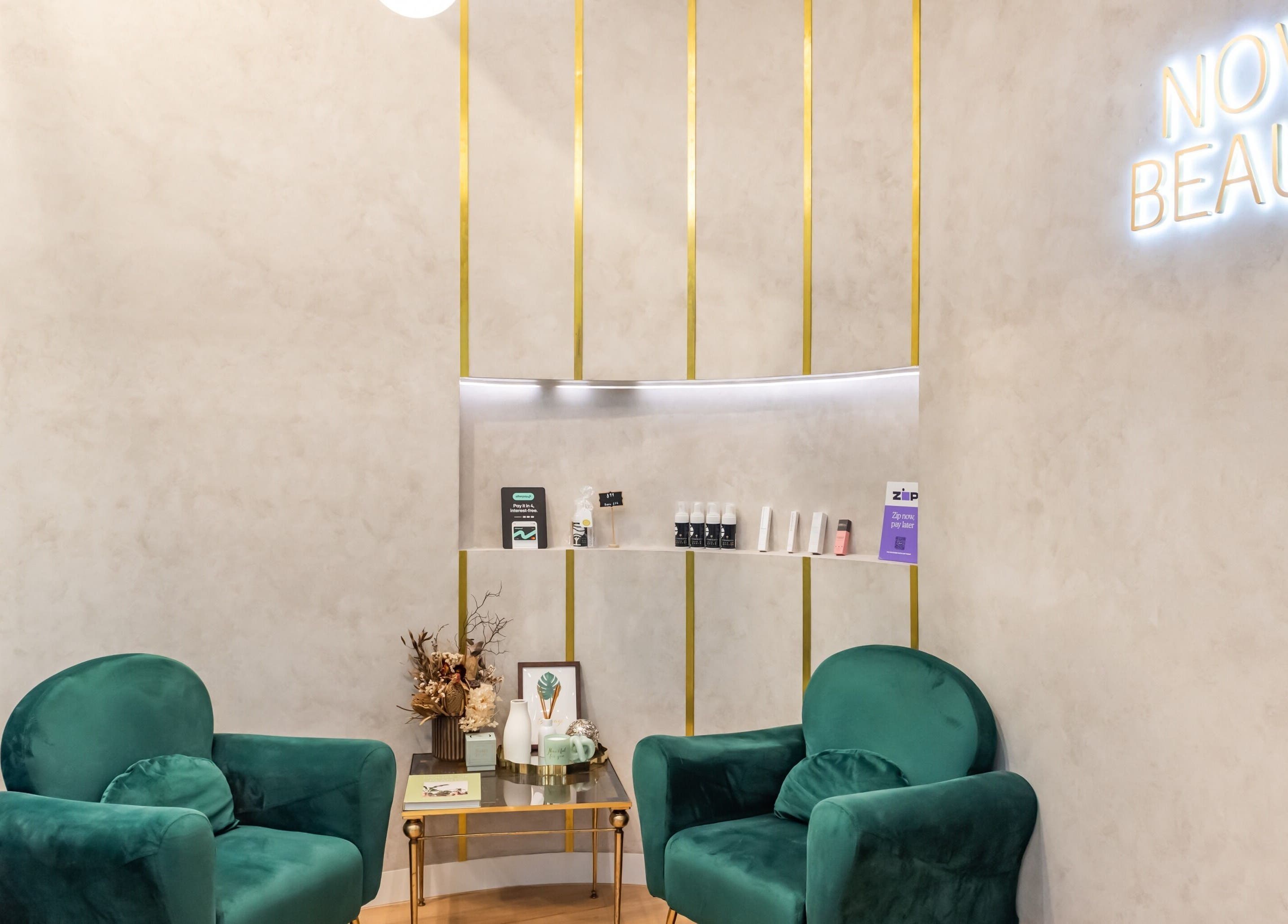 Elegant waiting area at Nova Beauty Charlestown, New South Wales, AU, featuring plush chairs and decor.