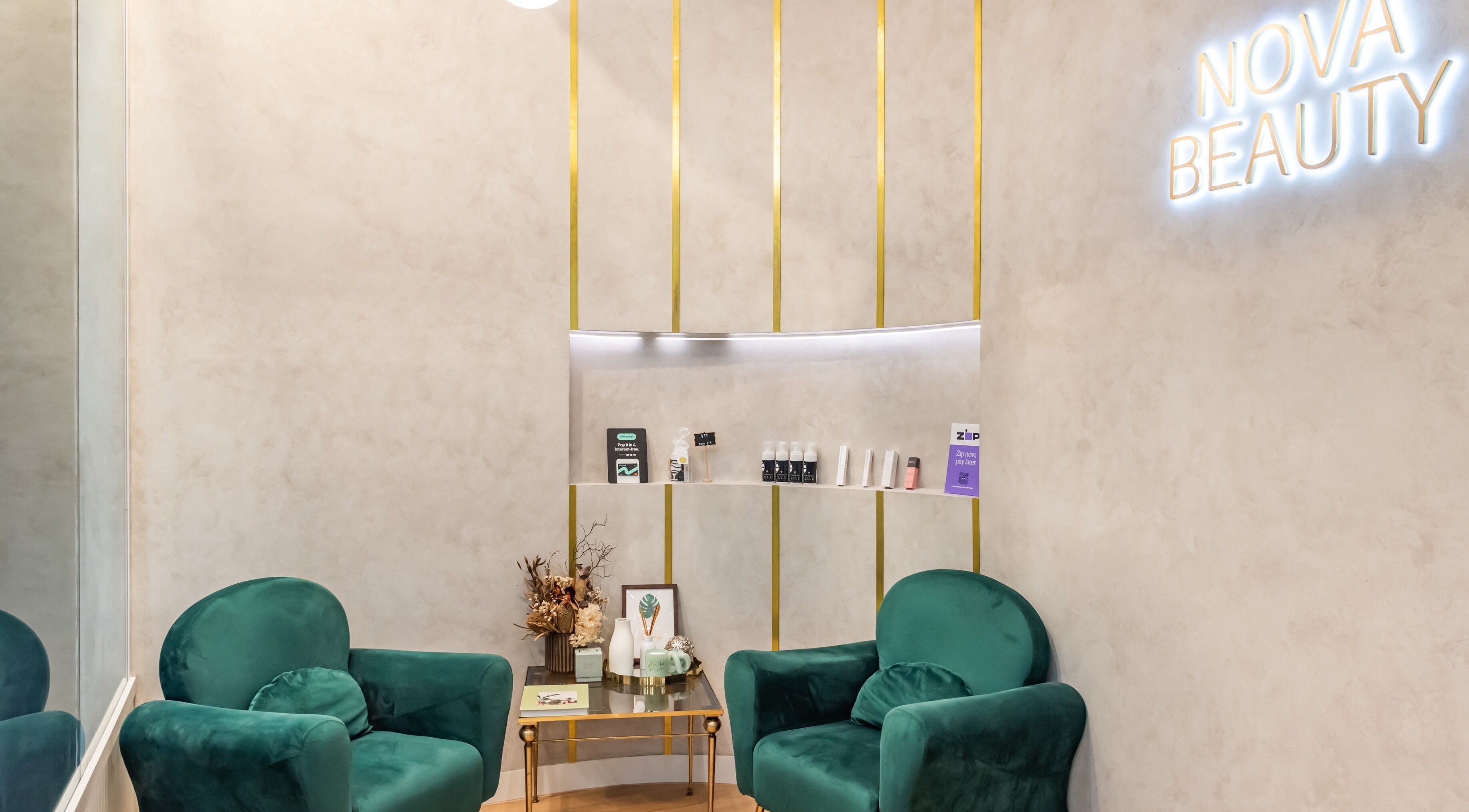 Elegant waiting area at Nova Beauty Charlestown, New South Wales, AU, featuring plush chairs and decor.