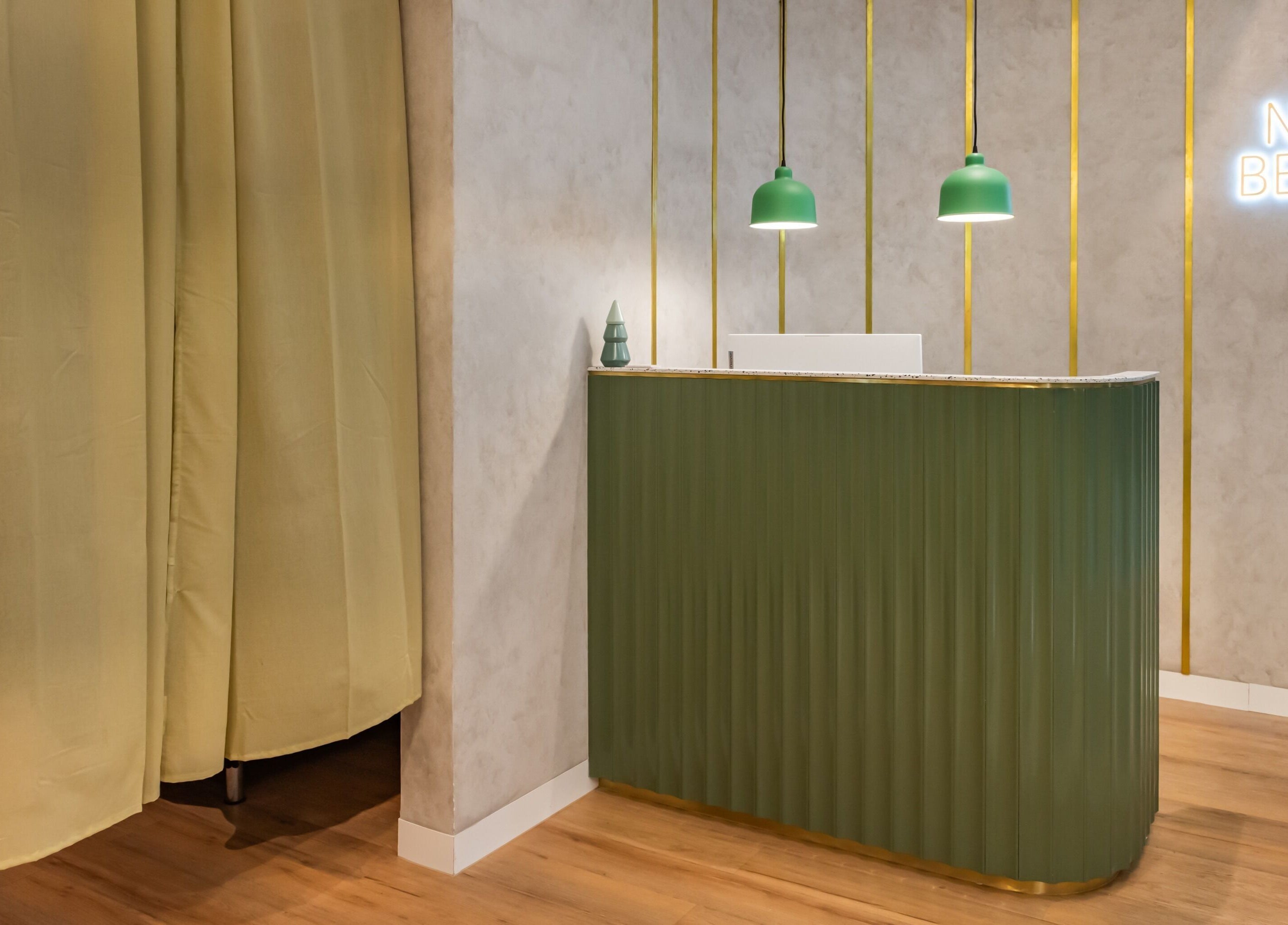 Reception area at Nova Beauty Charlestown, New South Wales, AU with green decor and modern design.