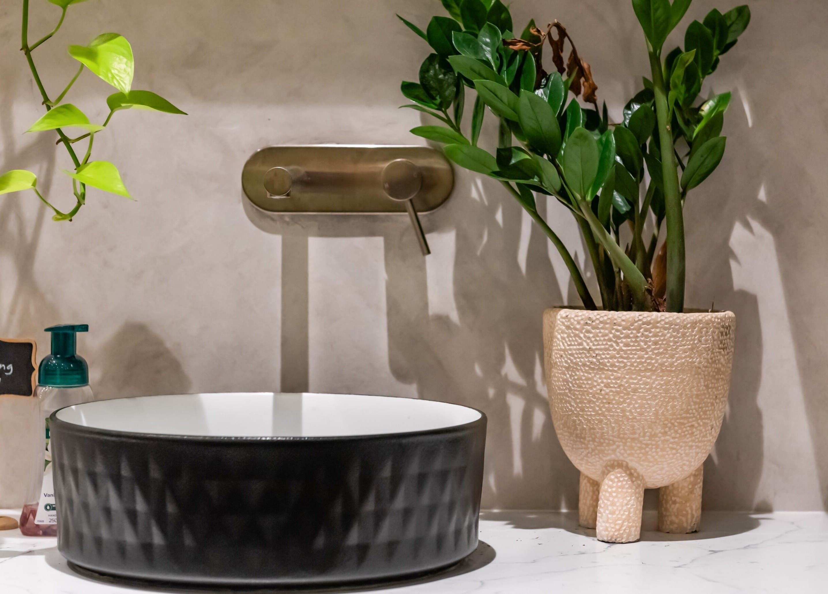 Elegant plant decor beside modern sink at Nova Beauty Charlestown, Charlestown, New South Wales, AU spa venue.