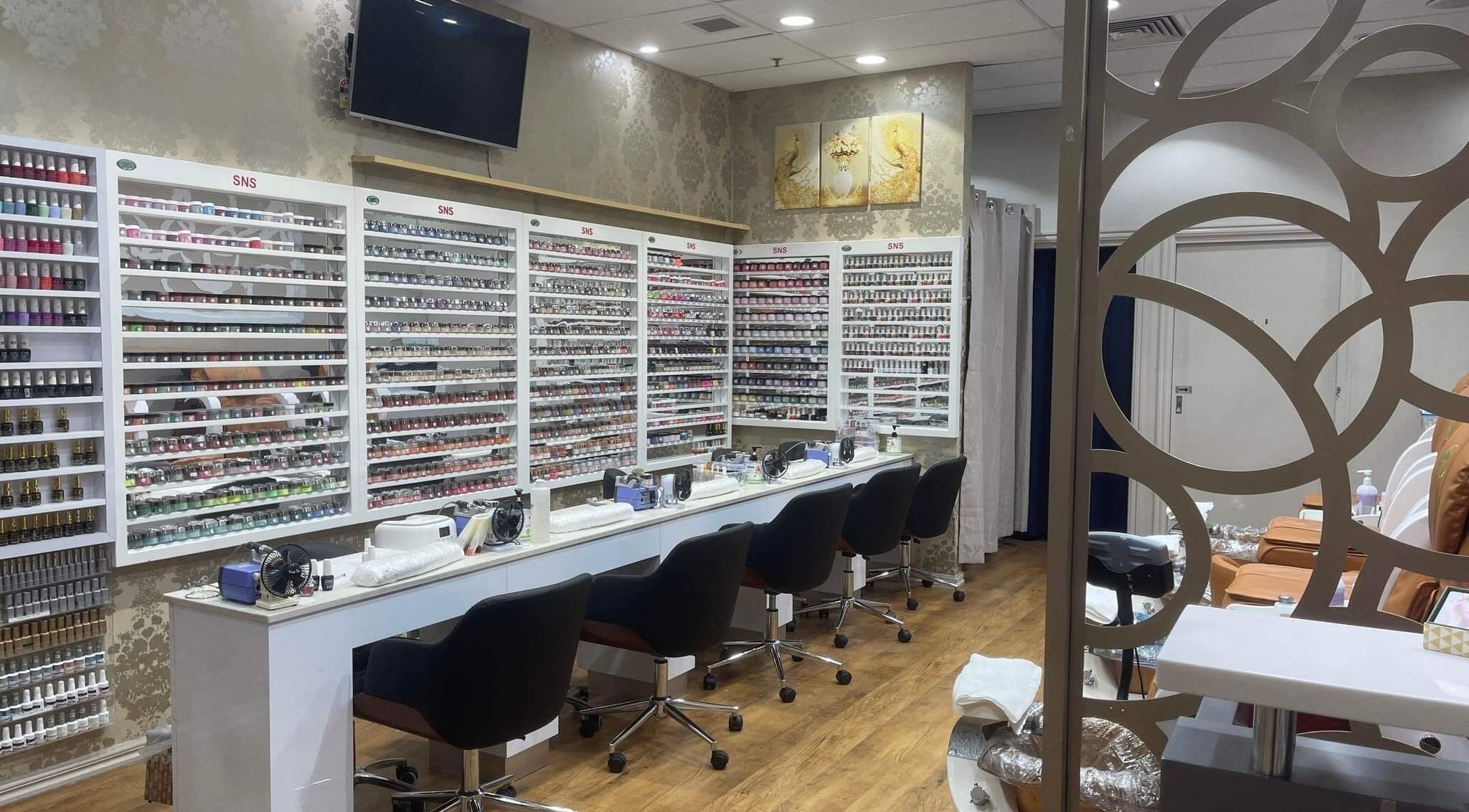 Interior view of Organic Nails and Beauty Northcote in Melbourne, Victoria, AU showing manicure stations and polish displays.