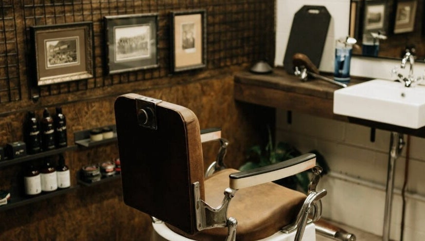 Vintage barber chair in Brookvale - Benicky and Sons, New South Wales, AU. Cozy and stylish decor.