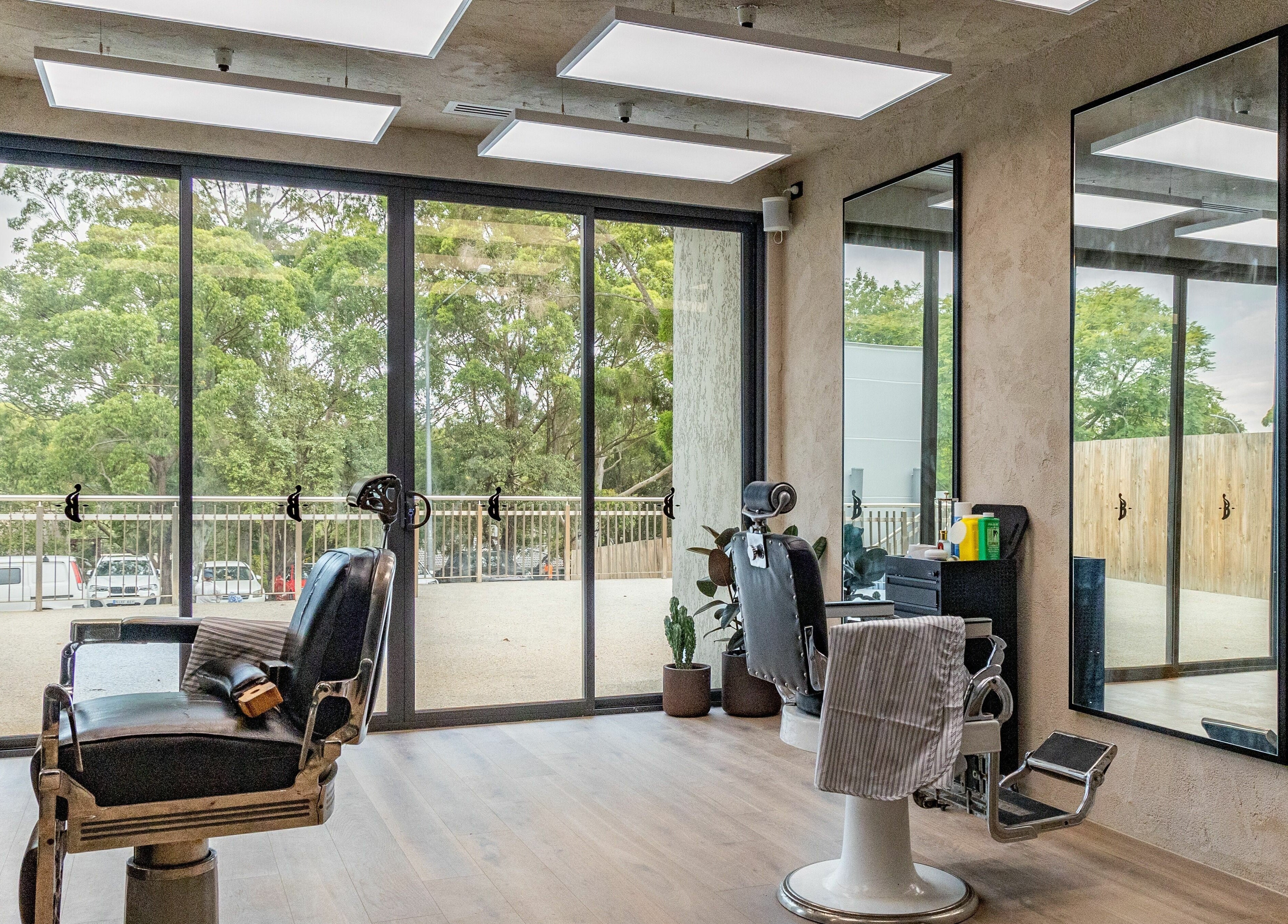 Sunlit barber chairs at Nth Turramurra - Benicky and Sons, North Turramurra, New South Wales, AU.