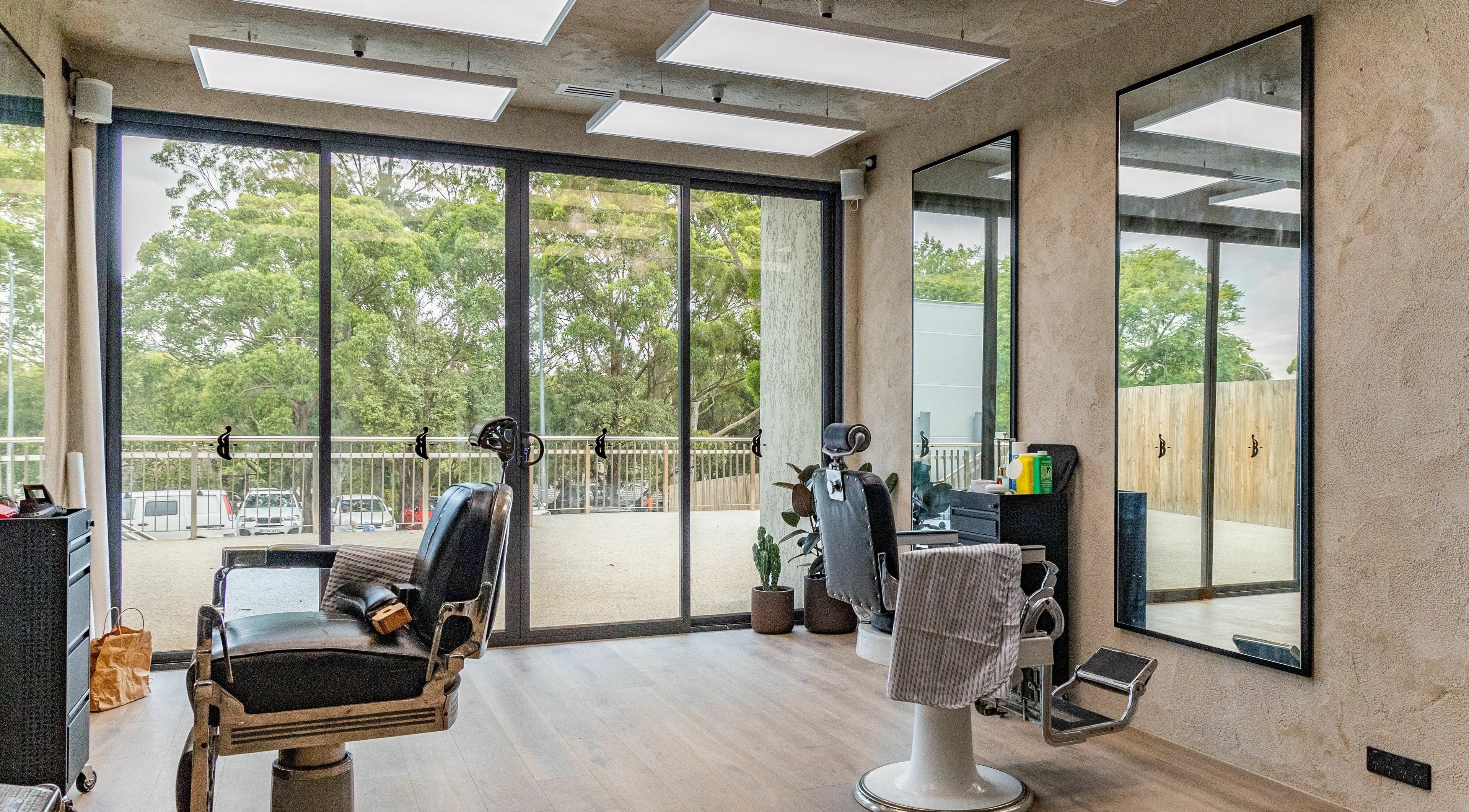 Sunlit barber chairs at Nth Turramurra - Benicky and Sons, North Turramurra, New South Wales, AU.