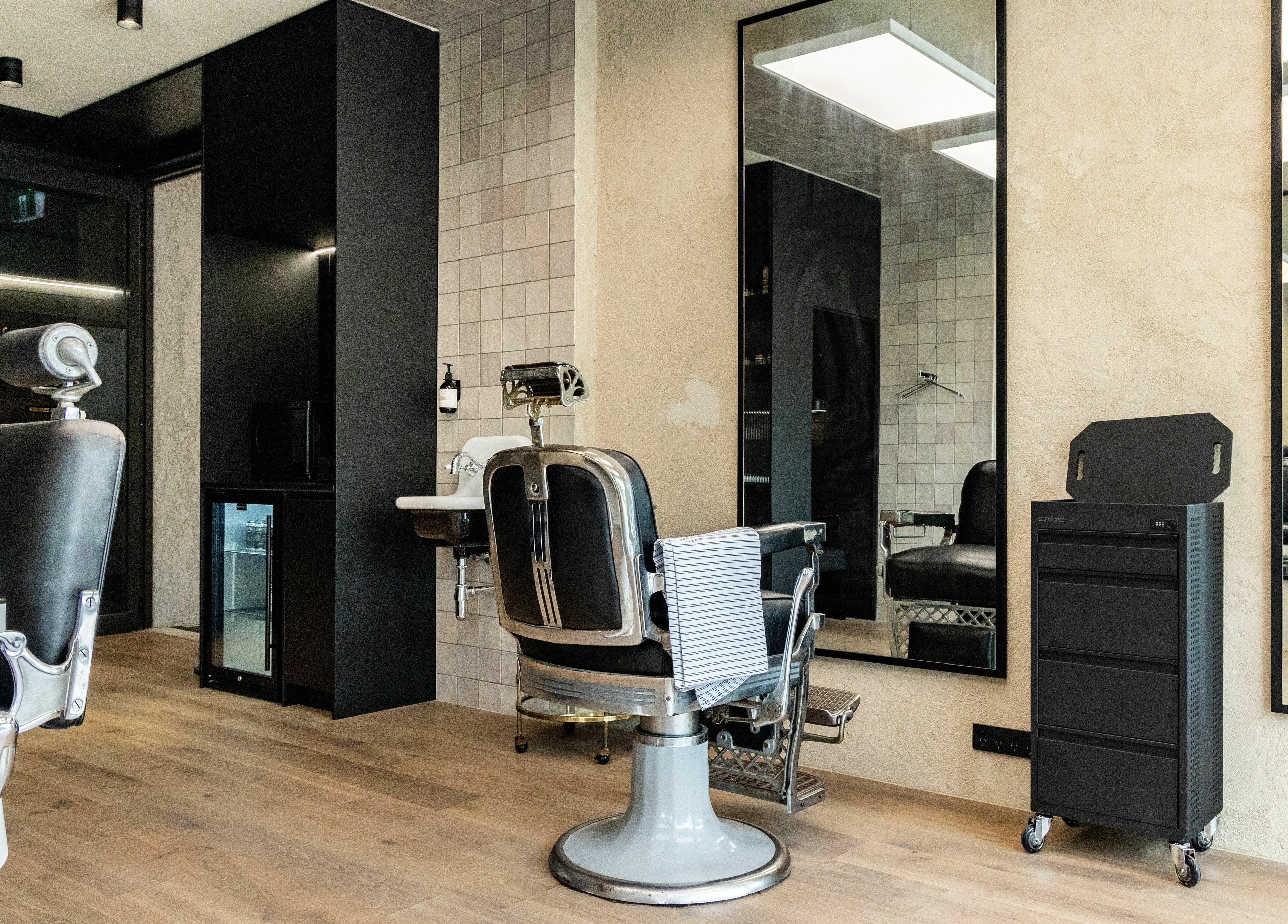 Elegant barber chair and decor at Nth Turramurra - Benicky and Sons, North Turramurra, New South Wales, AU.