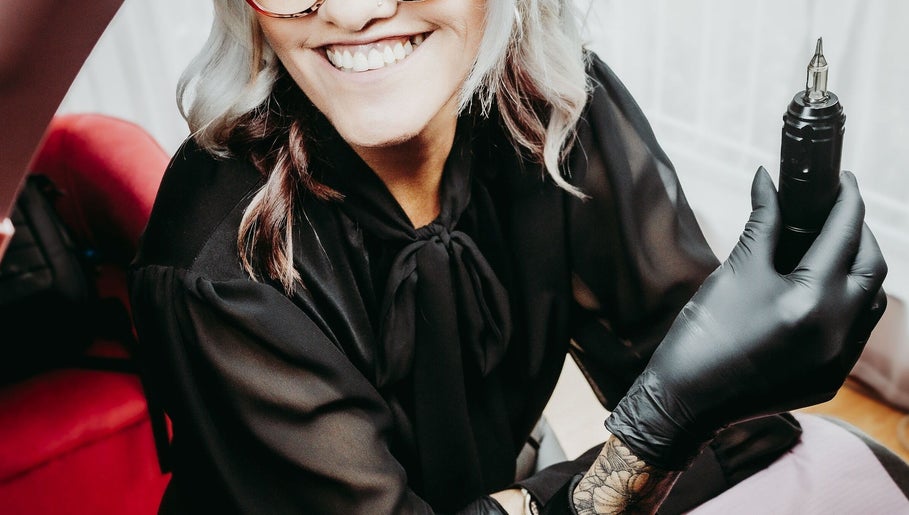 Beauty artist at Brow & Co Beauty Spa, Alberton, Gauteng, ZA, holding a professional tool.