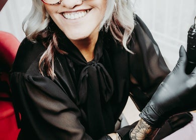 Beauty artist at Brow & Co Beauty Spa, Alberton, Gauteng, ZA, holding a professional tool.