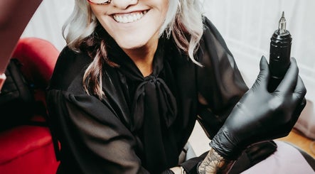 Beauty artist at Brow & Co Beauty Spa, Alberton, Gauteng, ZA, holding a professional tool.