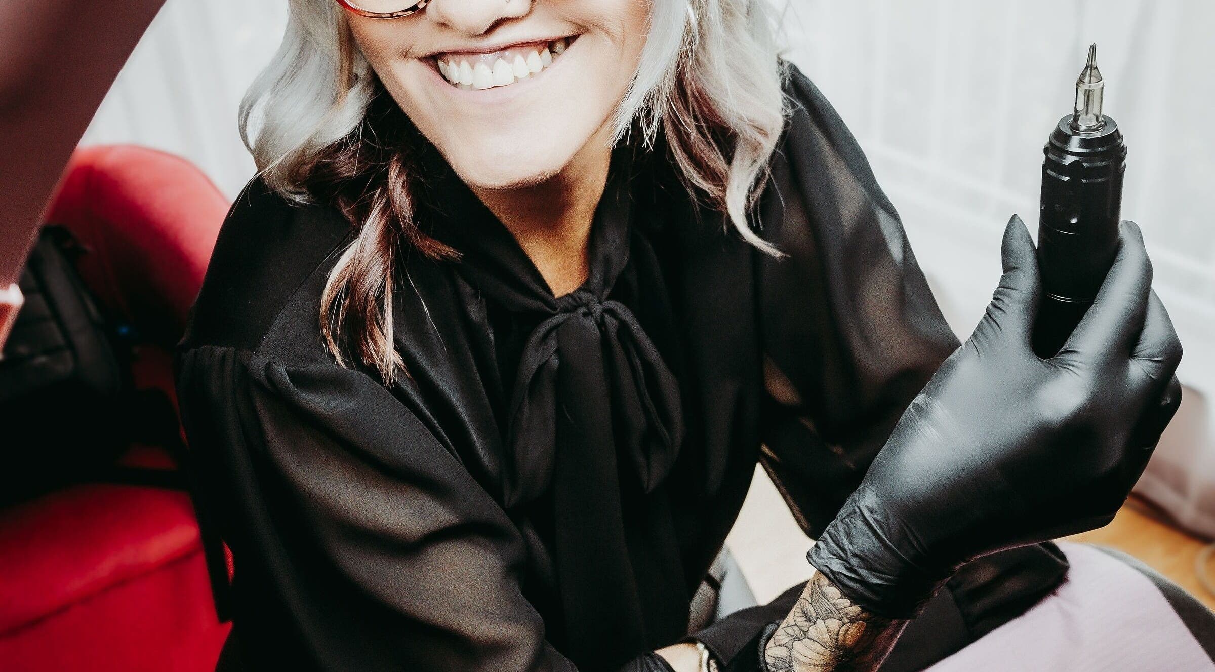 Beauty artist at Brow & Co Beauty Spa, Alberton, Gauteng, ZA, holding a professional tool.