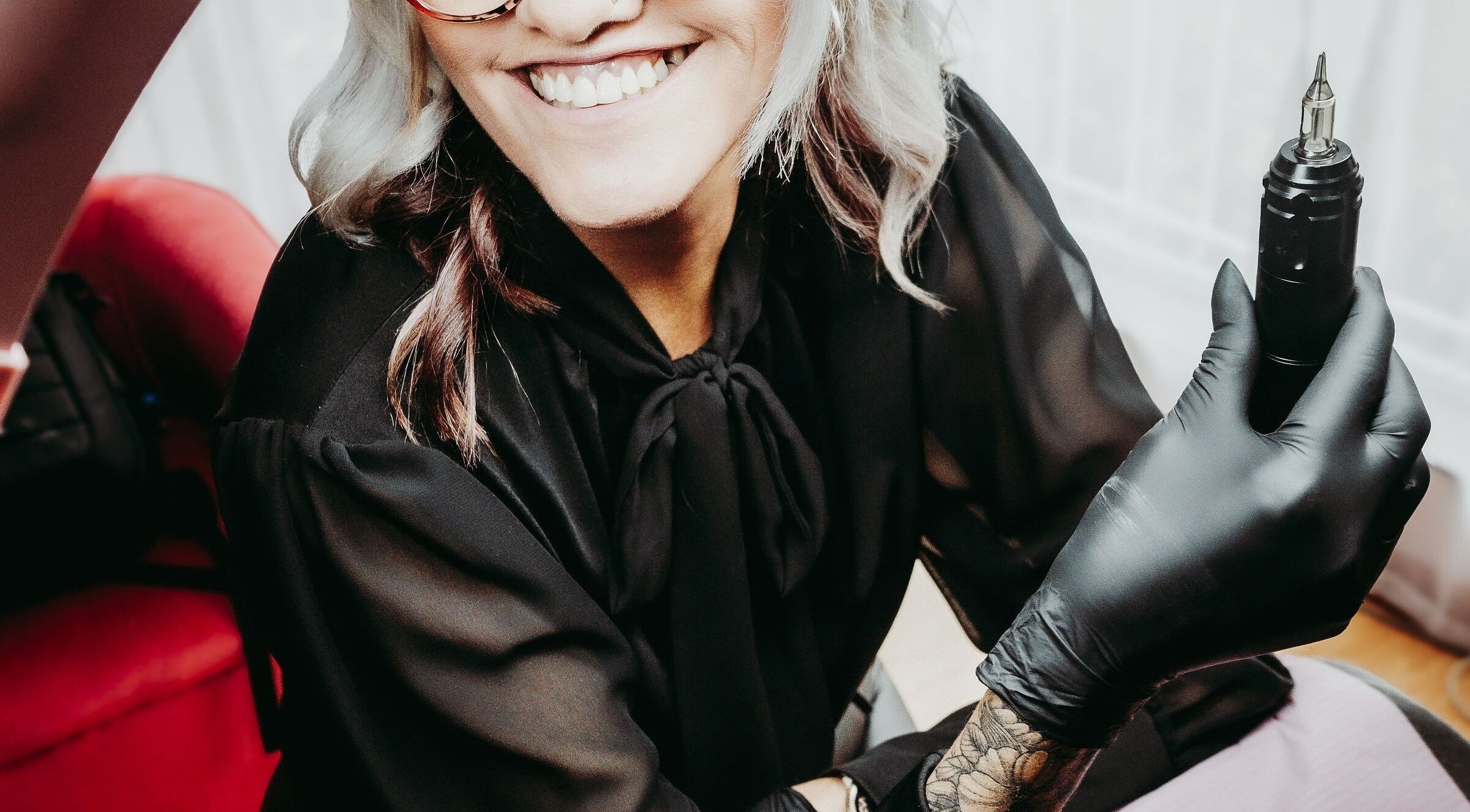 Beauty artist at Brow & Co Beauty Spa, Alberton, Gauteng, ZA, holding a professional tool.