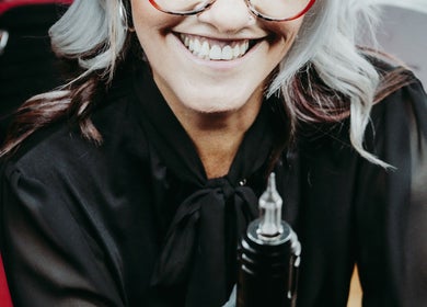 Happy stylist at Brow & Co Beauty Spa in Alberton, Gauteng, ZA, holding a beauty tool.