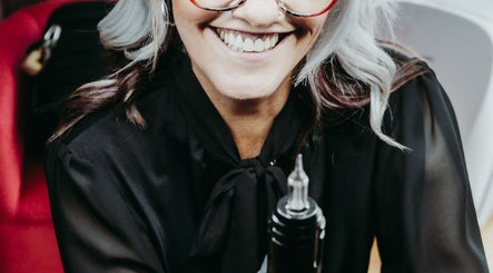 Happy stylist at Brow & Co Beauty Spa in Alberton, Gauteng, ZA, holding a beauty tool.