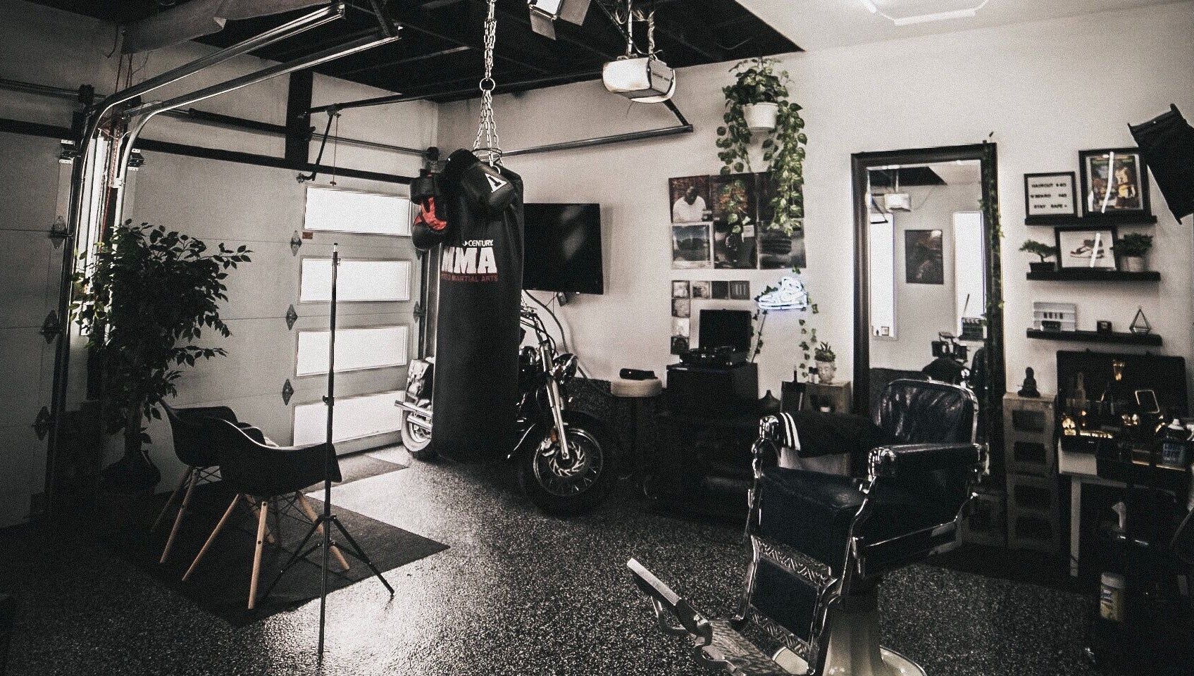 Contemporary interior of Le Studio Noir in Whitby, Ontario, CA featuring modern decor and a boxing bag.