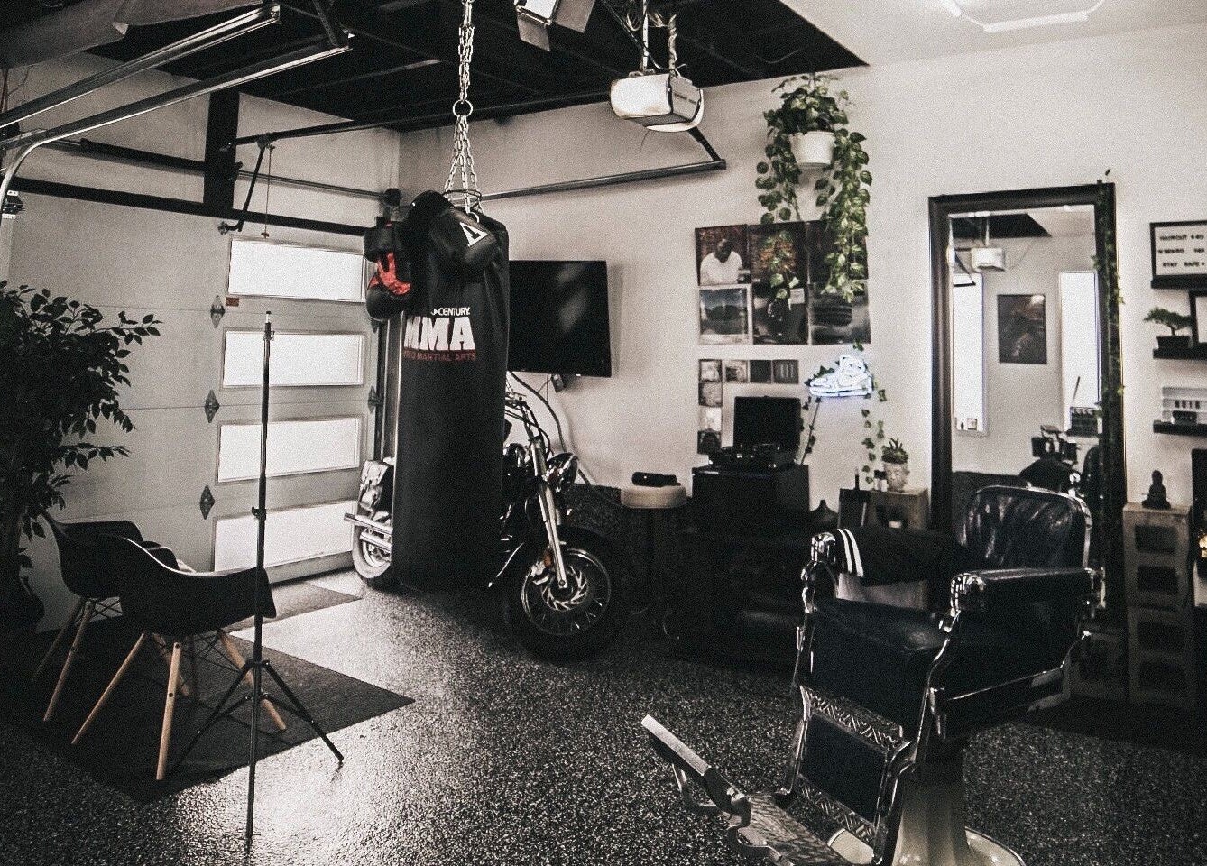 Contemporary interior of Le Studio Noir in Whitby, Ontario, CA featuring modern decor and a boxing bag.