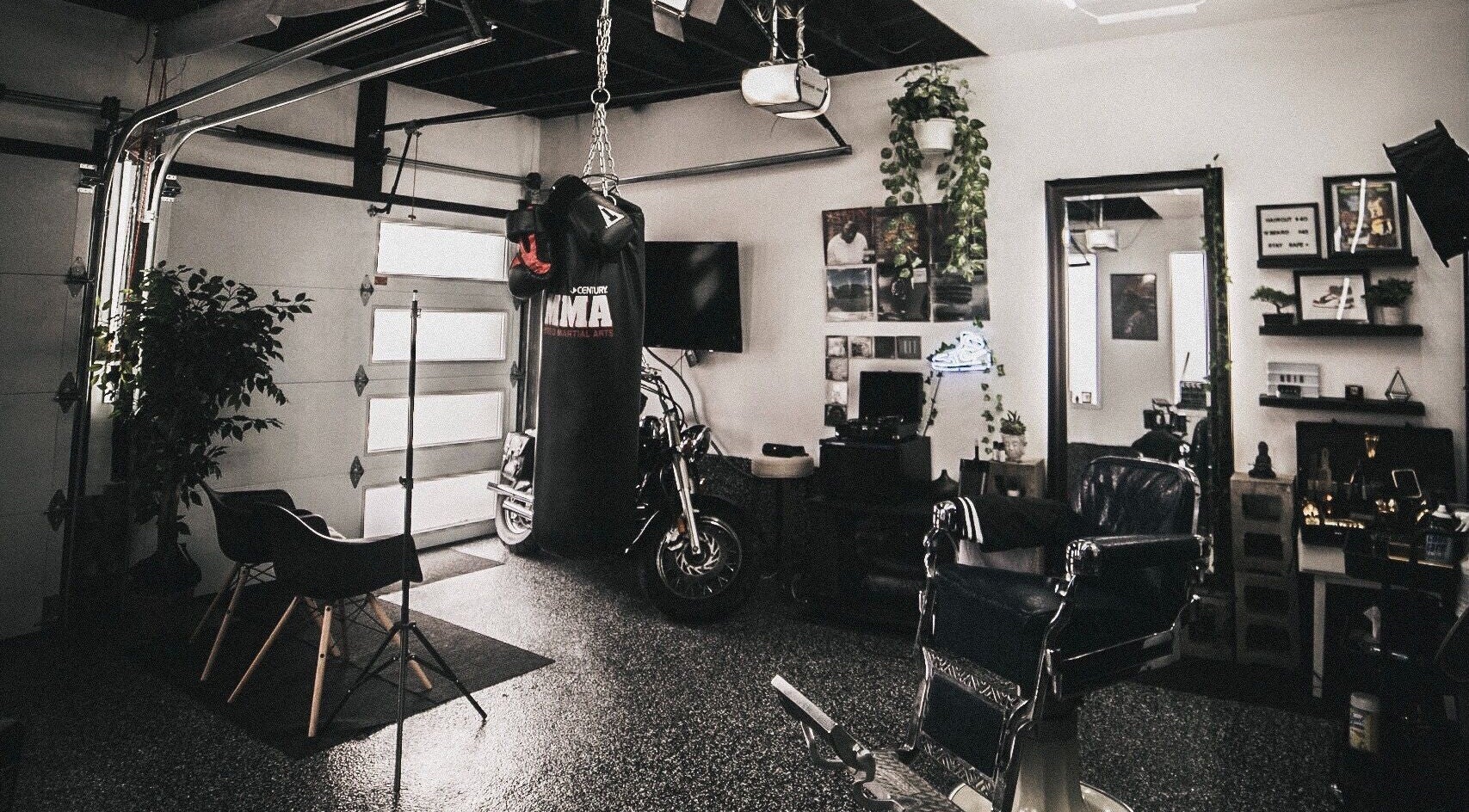 Contemporary interior of Le Studio Noir in Whitby, Ontario, CA featuring modern decor and a boxing bag.