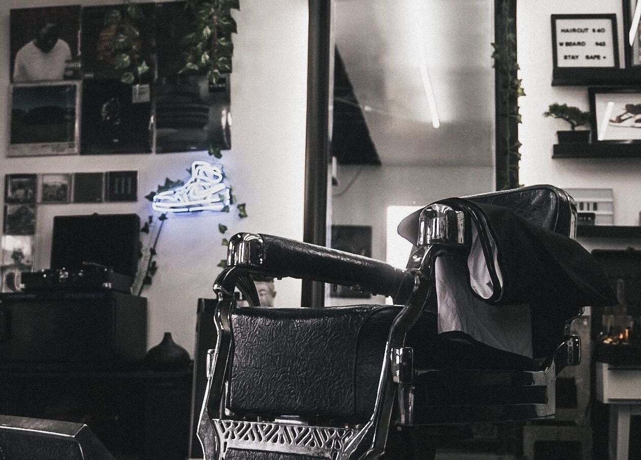 Elegant barber chair at Le Studio Noir, Whitby, Ontario, CA, showcasing a modern and stylish interior design.