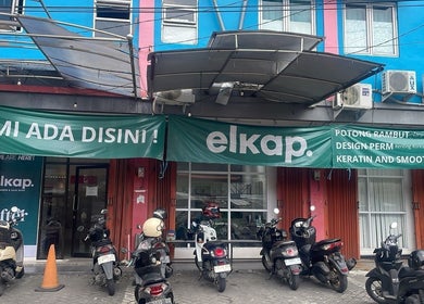 Entrance of ELKAP TRUNOJOYO salon located in Jawa Timur, Jawa Timur, ID with motorcycles parked outside.