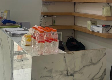 Reception area at ELKAP TRUNOJOYO, Jawa Timur, with marble counter and organized shelves.