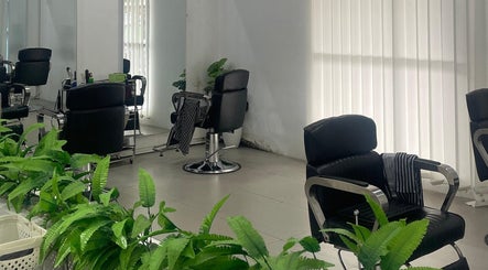 Modern salon chairs and lush plants at ELKAP TRUNOJOYO, Jawa Timur, Jawa Timur, ID. A calming, stylish space.