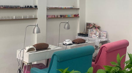 Cozy manicure station at MORI SALON, Jawa Timur, Jawa Timur, ID, with colorful nail polish display.