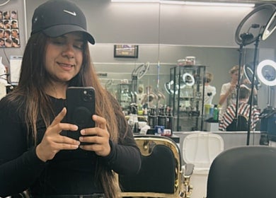 Mildred Barber in Stamford, Connecticut: Stylist captures a moment in a modern salon setting.