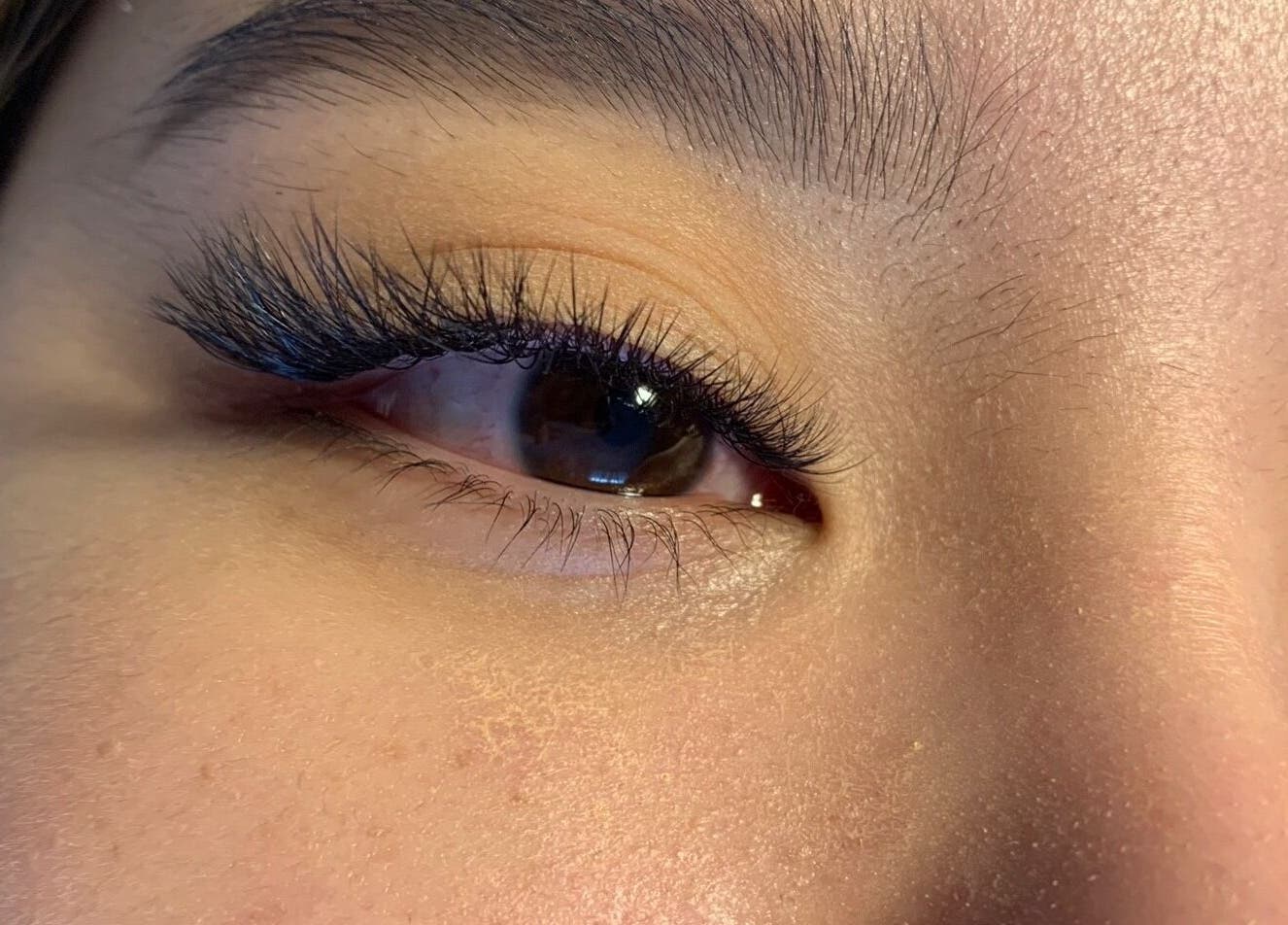 Beautifully enhanced lashes at Baillie’s Lashes, Whitley Bay, England, GB. Close-up showcases expert eyelash extensions.