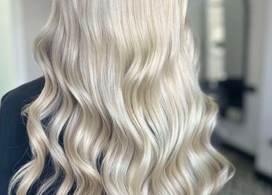 Blonde wavy hairstyle at Lucy Whatnell Hairdressing in Newbiggin-by-the-Sea, Northumberland, GB.