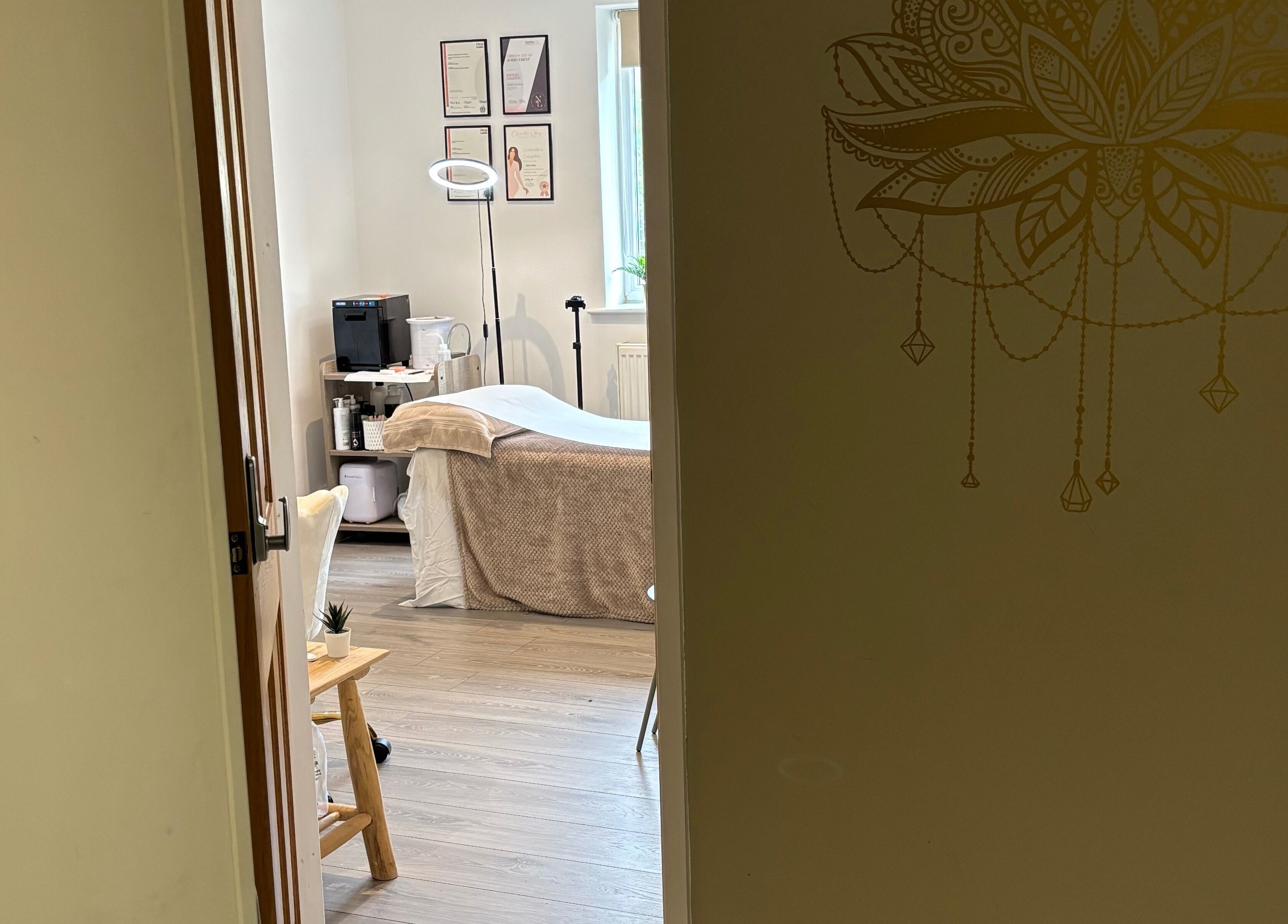 Cozy treatment room at Nova Nails & Beauty in Handforth, England, GB, featuring a serene spa bed and calming décor.