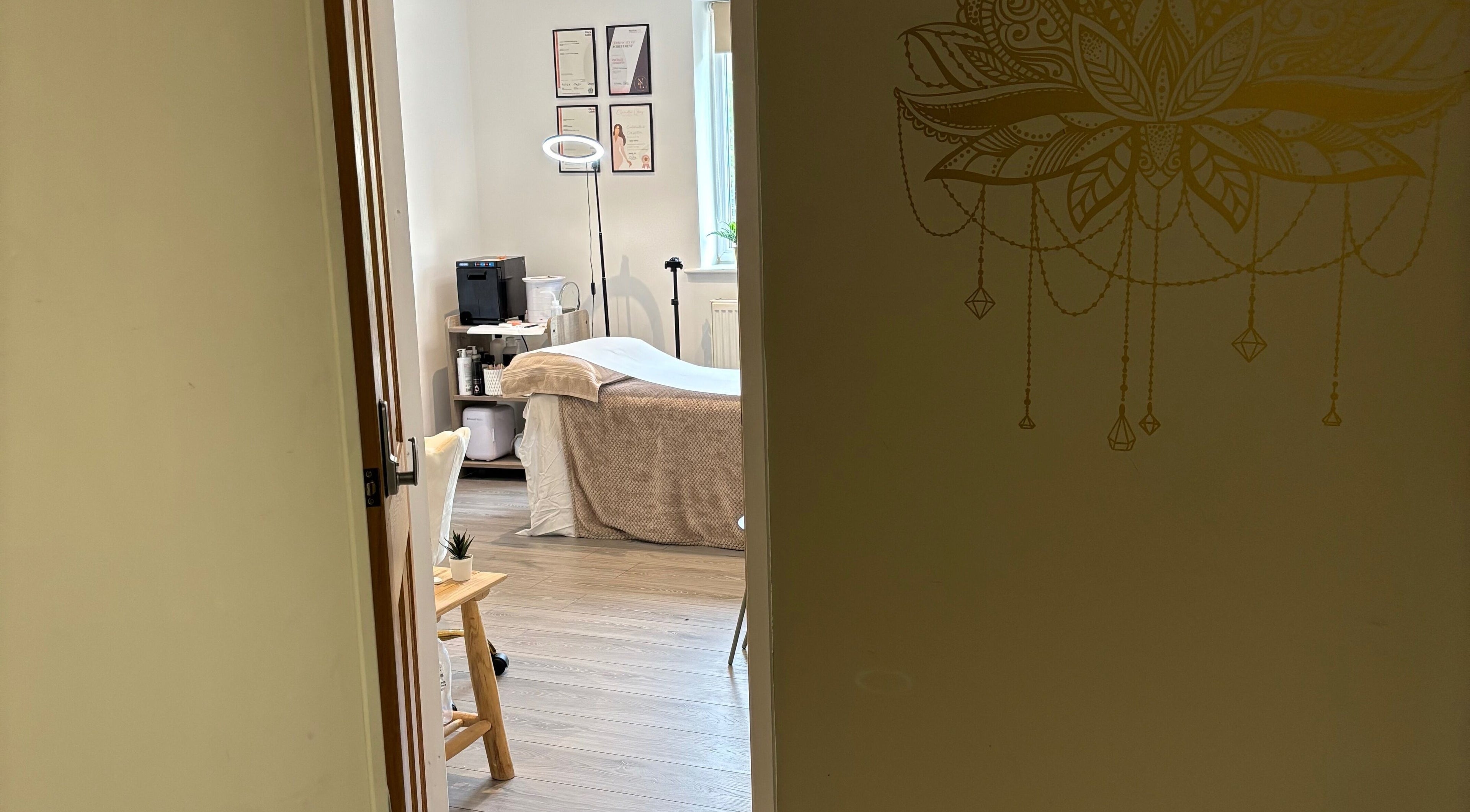 Cozy treatment room at Nova Nails & Beauty in Handforth, England, GB, featuring a serene spa bed and calming décor.