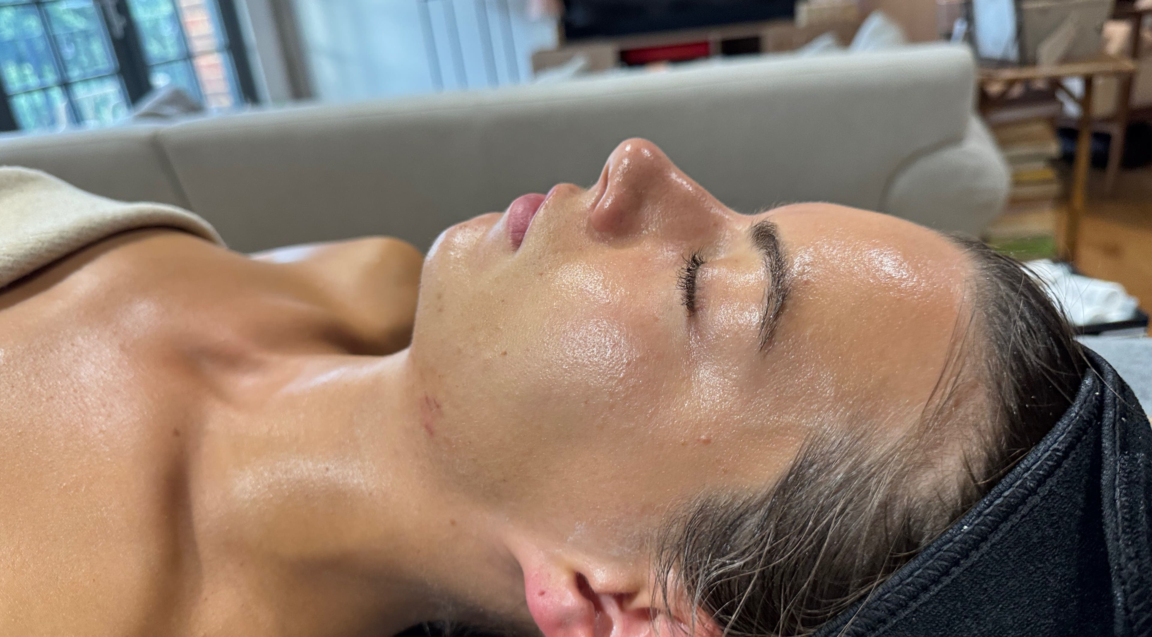 Relaxing facial treatment at Glo! SoS Face and Body Treatments, London, England, GB, enhancing skin radiance.