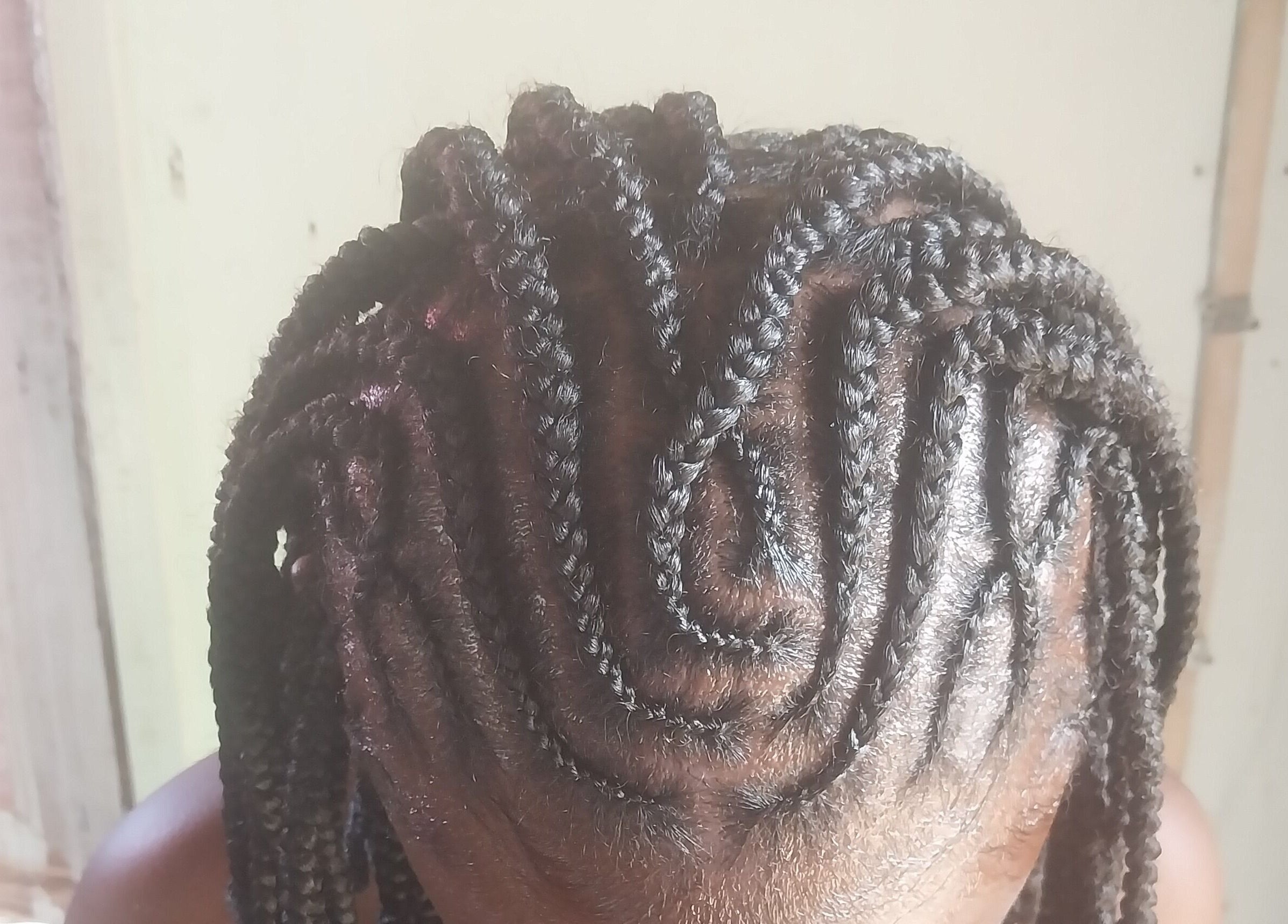 Intricate cornrow braiding at Braidsby.Merrika in Bridgetown, Saint George, BB.