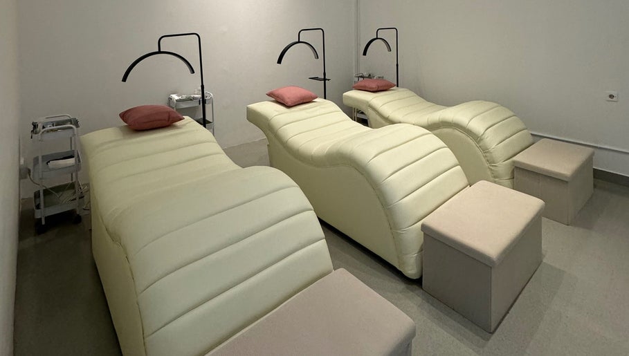 Tranquil treatment room at Moonlash Studio Tukad Barito in Bali, Bali, ID, featuring plush loungers for relaxation.