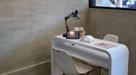 Nail treatment station at Moonlash Studio Tukad Barito, Bali, Bali, ID with modern white desk and tools.