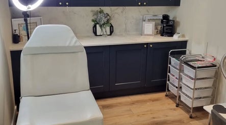 Modern treatment room at Cambridge Permanent MakeUp, Warboys, England, GB featuring sleek decor and equipment.