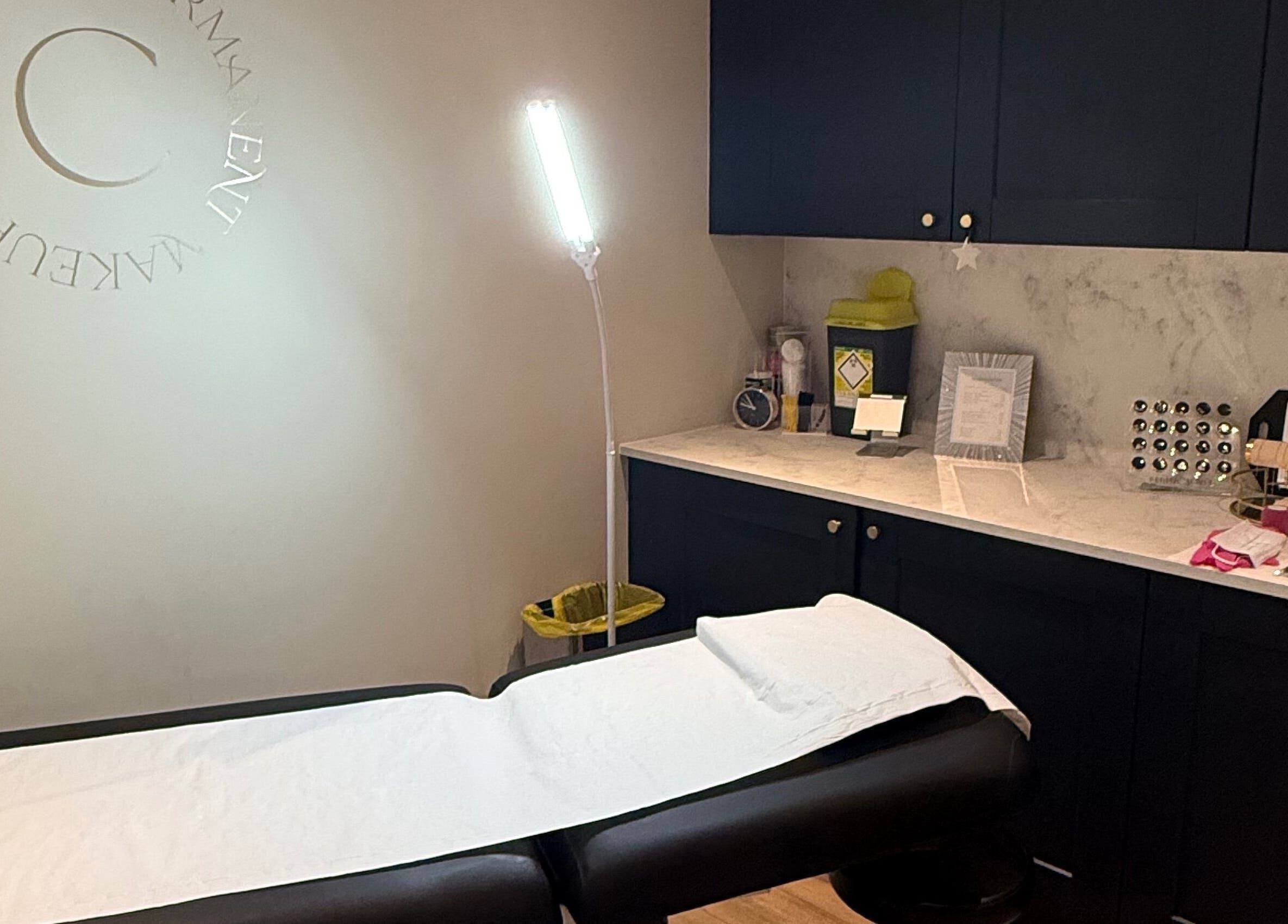 Cambridge Permanent MakeUp studio in Warboys, England featuring a serene treatment bed and tools.