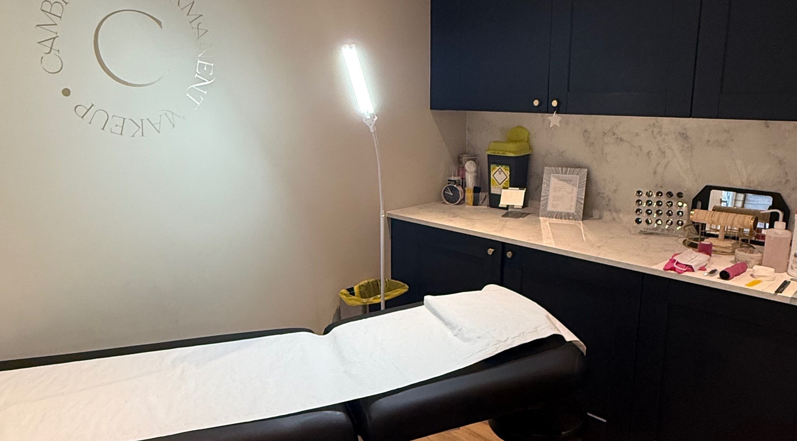 Cambridge Permanent MakeUp studio in Warboys, England featuring a serene treatment bed and tools.