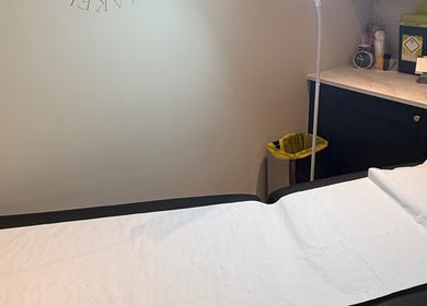 Calm treatment room at Cambridge Permanent MakeUp, Warboys, England, GB with a prepared bed.