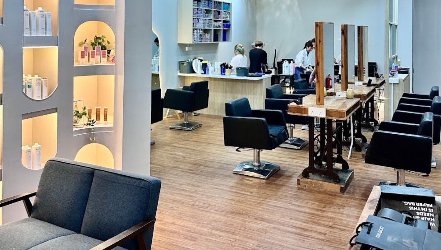 Modern interior of Elements Hair Salon in Cheras, Selangor, MY, featuring stylish seating and product displays.