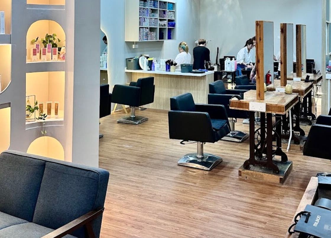 Modern interior of Elements Hair Salon in Cheras, Selangor, MY, featuring stylish seating and product displays.