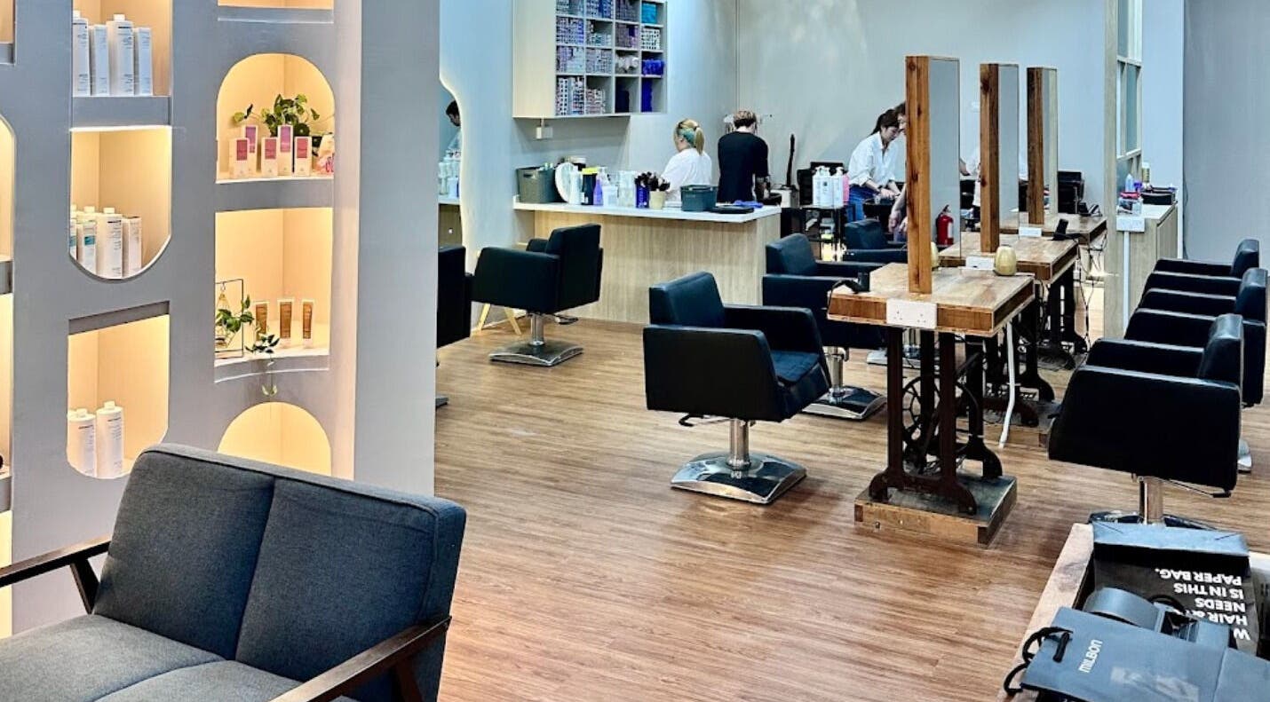 Modern interior of Elements Hair Salon in Cheras, Selangor, MY, featuring stylish seating and product displays.