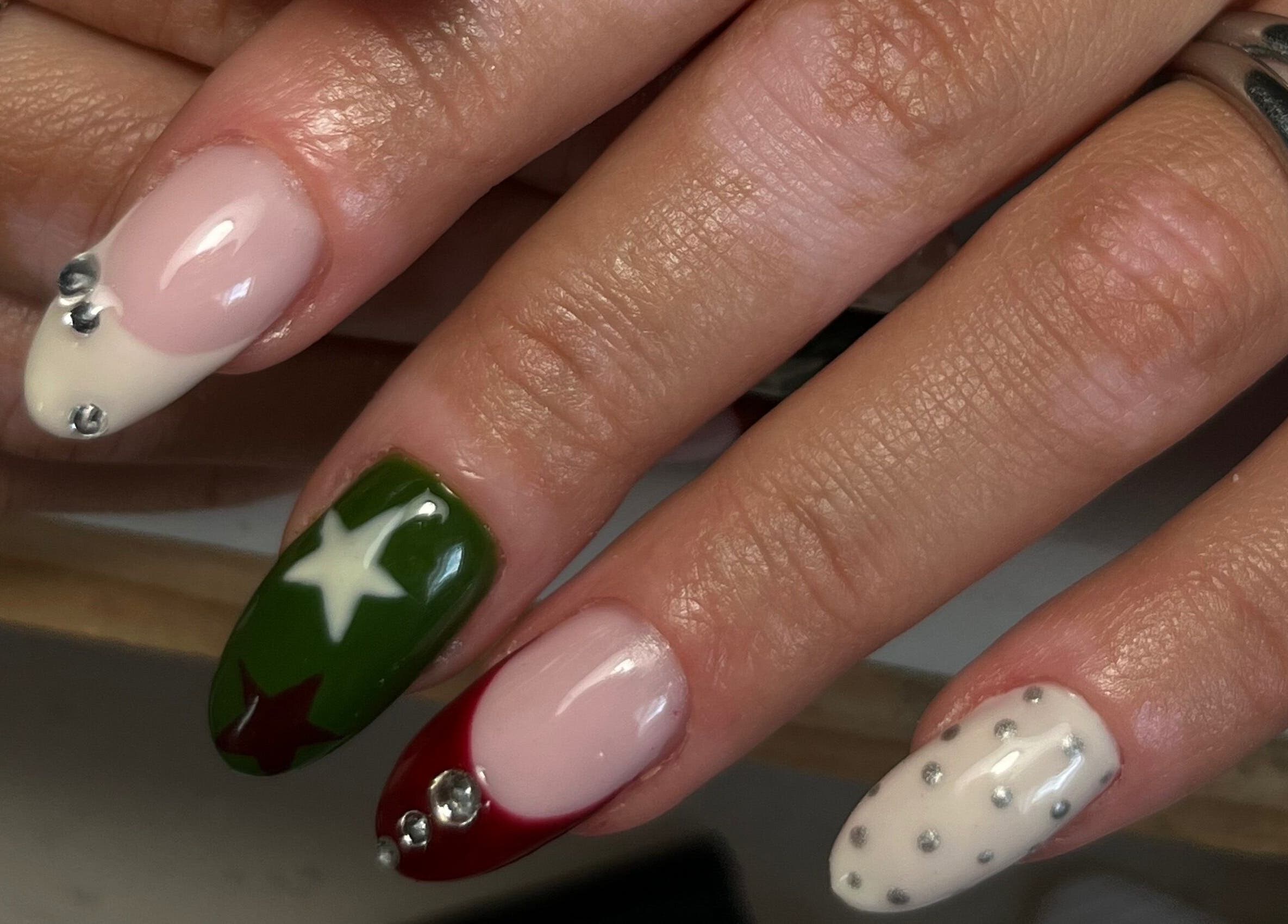 Festive nail art with stars and gems by Nails by Zofia in County Kildare, County Kildare, IE.