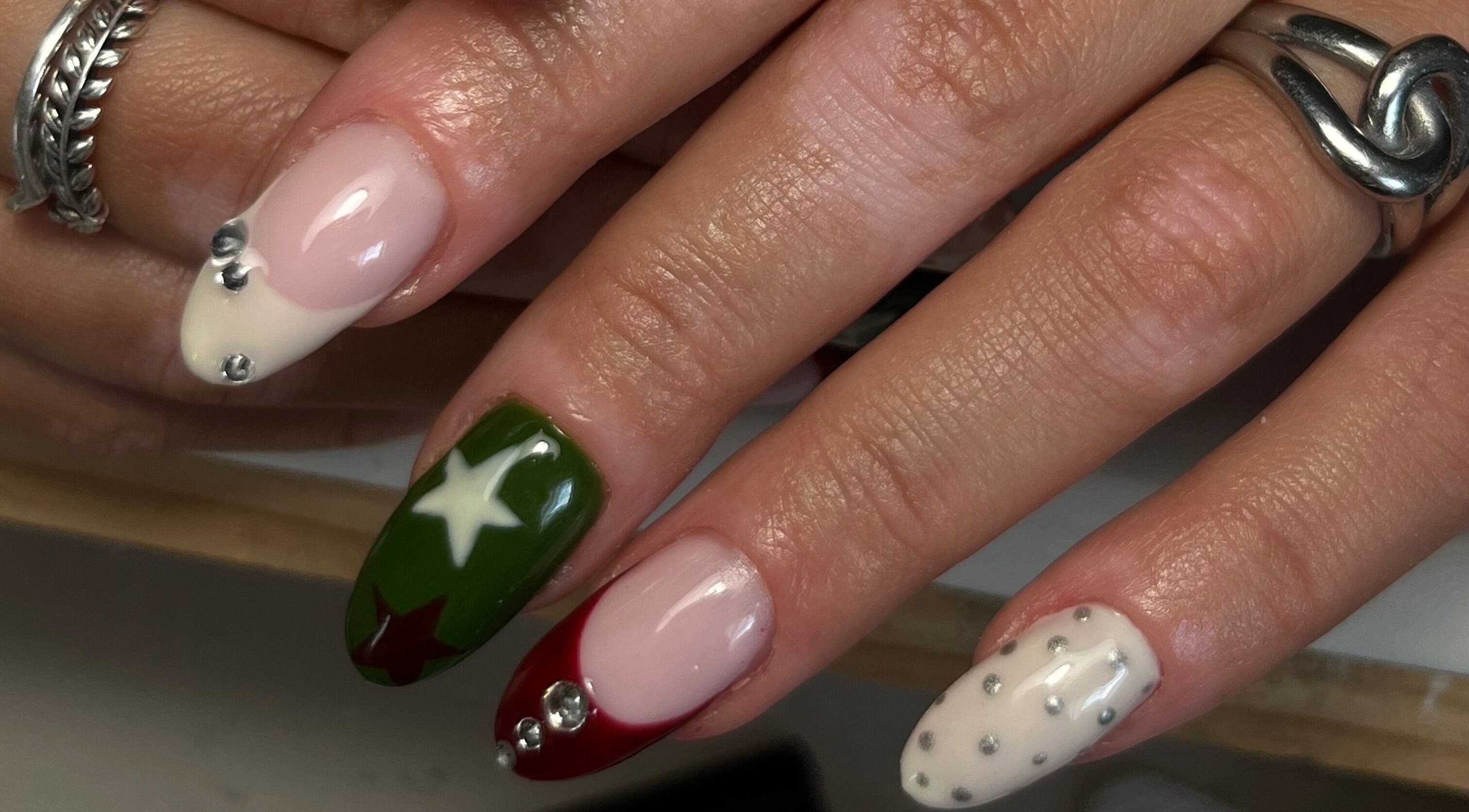 Festive nail art with stars and gems by Nails by Zofia in County Kildare, County Kildare, IE.