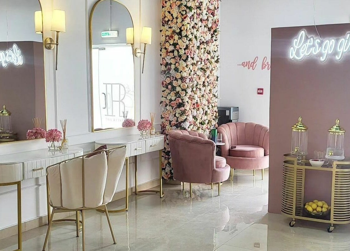 Elegant interior of The Retreat in Dubai, Dubai, AE, featuring plush seating and floral decor.
