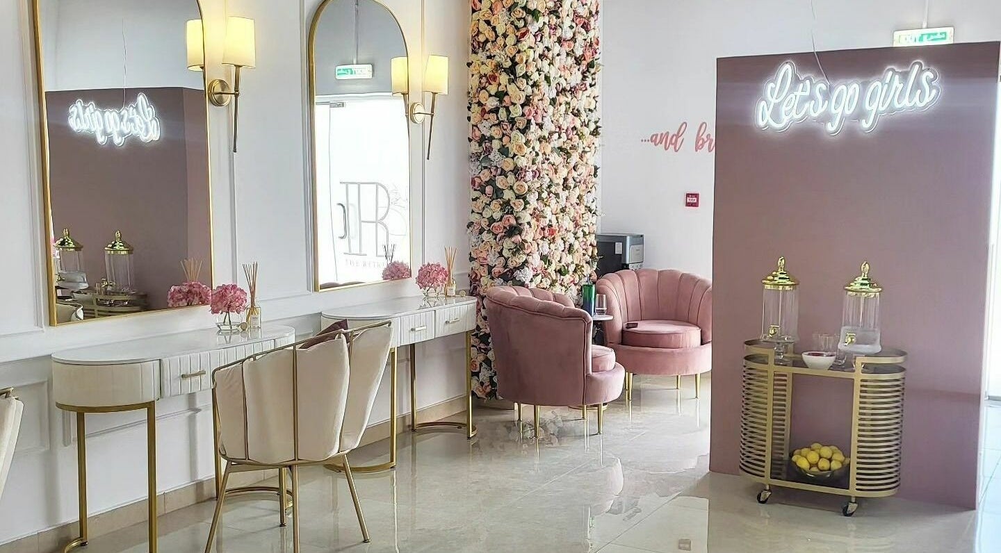 Elegant interior of The Retreat in Dubai, Dubai, AE, featuring plush seating and floral decor.