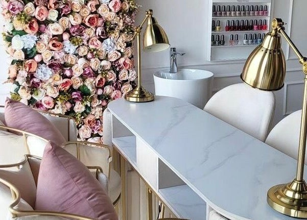 Luxurious nail station at The Retreat, Dubai, Dubai, AE, featuring floral wall and elegant seating.