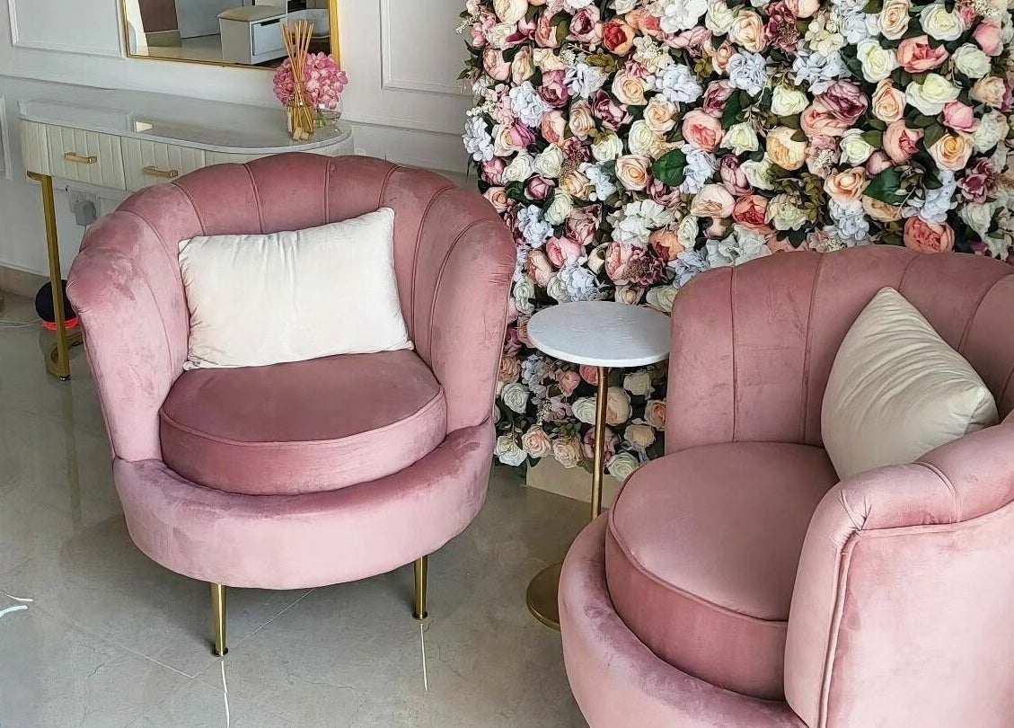 Elegant pink chairs in a floral setting at The Retreat, Dubai, Dubai, AE. Perfect for relaxation and luxury.