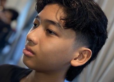 Effcutz hairstyle on a young client in Singapore, Singapore, SG showcasing a fresh, stylish haircut.