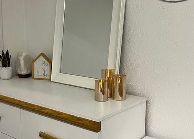 Elegant decor at Bridget Wilson Esthetics Studio, Sault Ste. Marie, Ontario, CA with candles and a mirror.